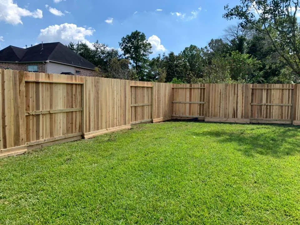 Repaired cedar fence section with new posts, Galveston Bay area
